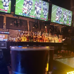 Bar area with lots of tvs