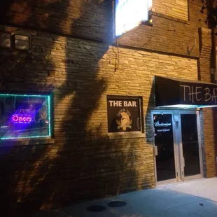 the entrance to the bar at night