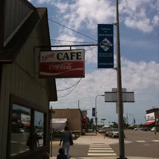 a woman and child walking down the sidewalk