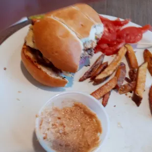 a plate of french fries and a side of ketchup