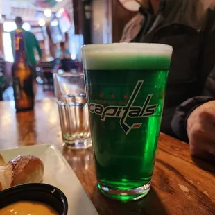 New Trails Crisp Lager, dyed green for St. Patrick's Day