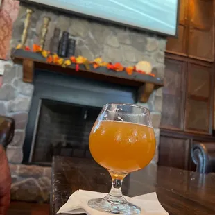 a glass of beer on a table