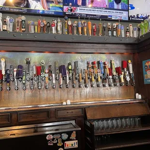 a wall full of beer taps