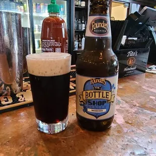 a bottle and a glass of beer