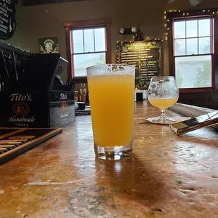 a glass of beer on the bar