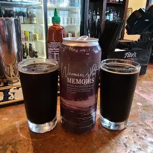 three glasses of beer on a bar