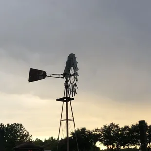 a windmill and a pickup truck