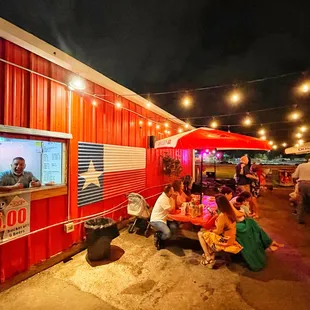 a group of people eating outside