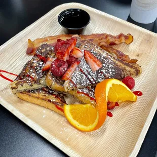 french toast with strawberries and orange slices