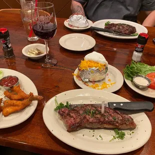 New York Strip Fried Jumbo Shrimp baked potato The Ribeyes