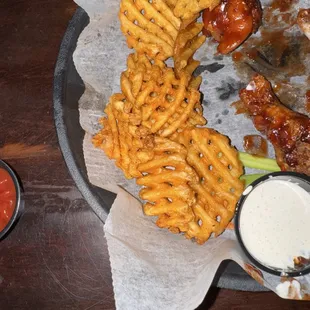 What&apos;s left of my wings and waffle fries!! So yummy