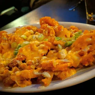 Buff and Jacked - Waffle fries, tossed in Buffalo sauce, loaded with blue cheese crumbles, melted Colby Jack cheese and green onions.
