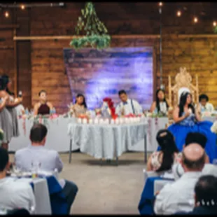 A natural wood wall is the perfect location for the head table. 2018
