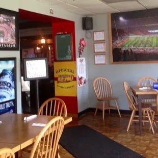 The entrance to the bar and seat yourself sign.