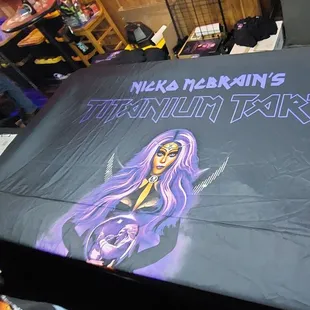 Nicko McBrains Titanium Tart Merch area