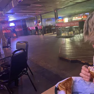a woman eating a slice of pizza