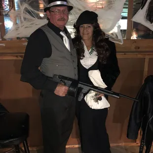 a man and a woman dressed up in costumes