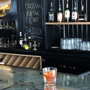 a bar with bottles of alcohol