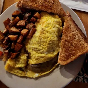 Barrel omelet (mushrooms, onions, peppers, &amp; choice of cheese and meat) served with potatoes and toast.