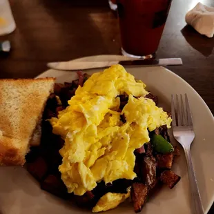 Sunday brunch item. Corned beef, potatoes, eggs, &amp; toast.