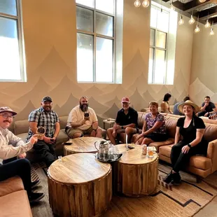 a group of people sitting around a table