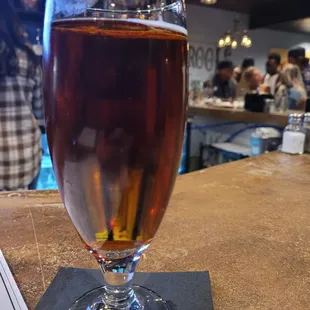 a glass of beer on the bar