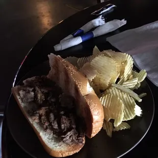 a sandwich and chips on a plate
