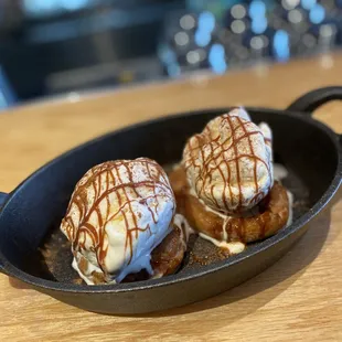 two desserts in a cast iron skillet