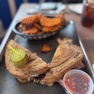 Rueben Sandwich with sweet potato fries.
