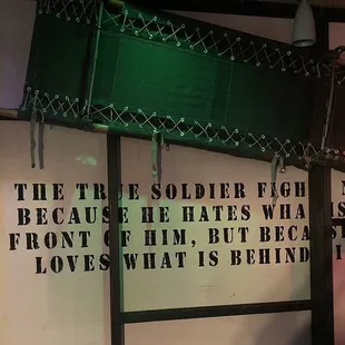 a sign that reads the three soldier fish no because he hates what&apos;s in front of him, but because he