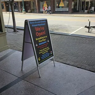 a sign on the sidewalk