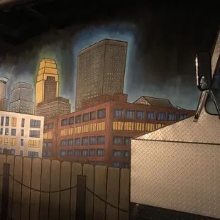 a mural of a city