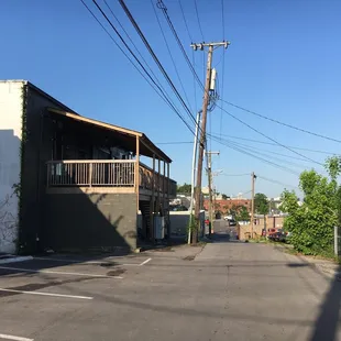 an empty parking lot with graffiti on it