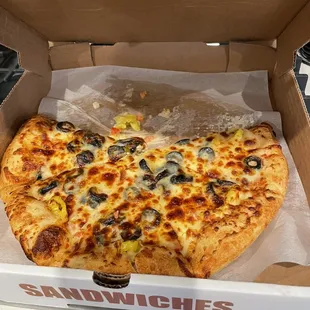 a pizza in a cardboard box