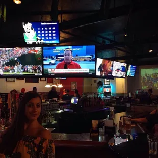 a woman sitting at a bar