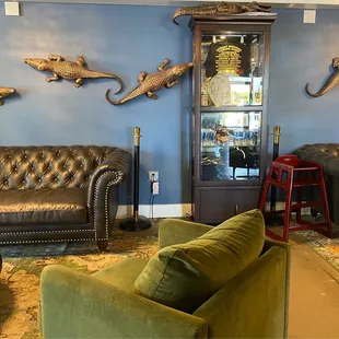 a living room with couches and chairs