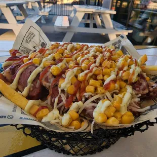 a hot dog covered in condiments