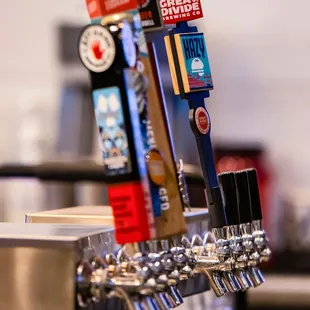 a row of beer taps