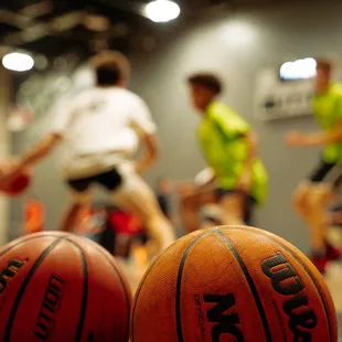 a group of people playing basketball