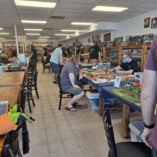 a group of people sitting at tables