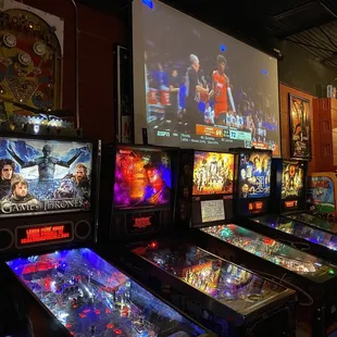 a row of pinball machines