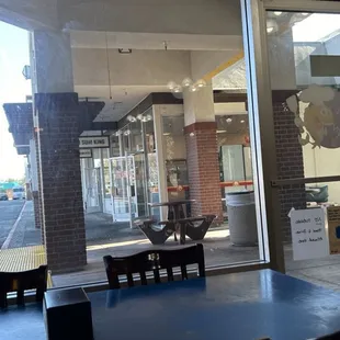 a woman walking past a window