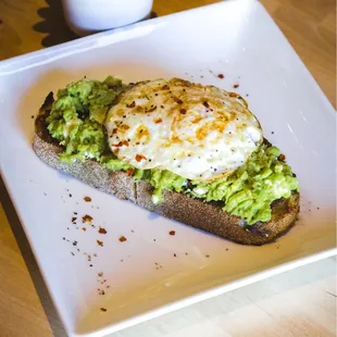 a plate of food with avocado on it