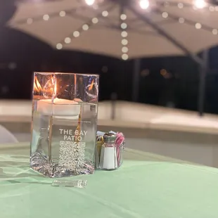 a candle and gift on a table