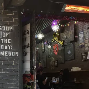 a person sitting at a table in a restaurant