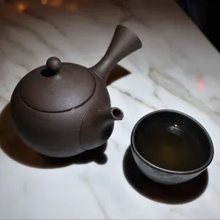a teapot and a cup of tea