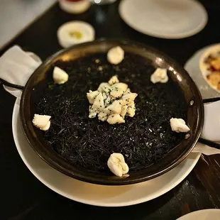 'ROSSEJAT' NEGRA paella-style pasta, squid ink, sepia sofrito, blue crab $30