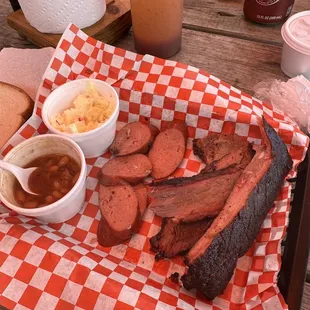 No way this is a 4 meat plate with double brisket. OVERCOOKED &amp; OVERPRICED