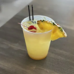 a drink with a pineapple garnish