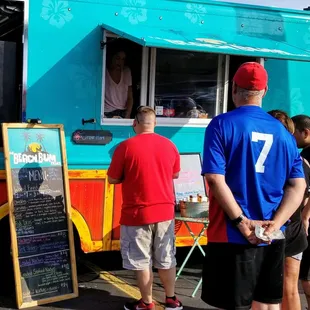 Line of peeps waiting for tacos.